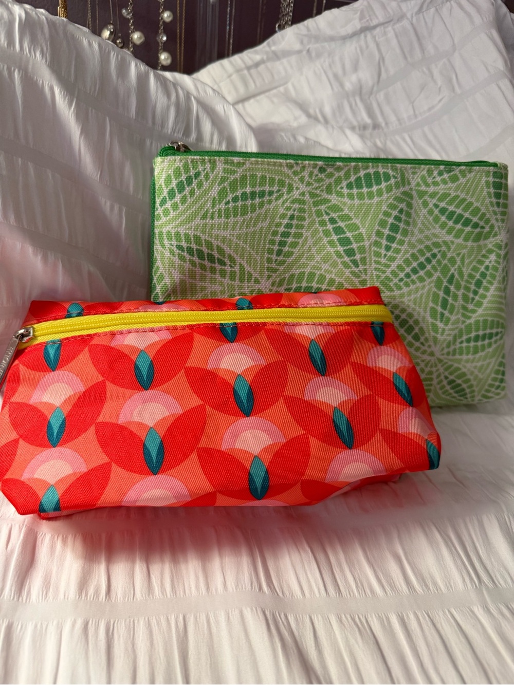 Set of two Clinique Cosmetic bags A Vibrant Orange Pattern & a Green pattern